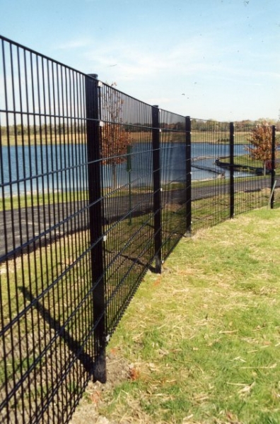 black fence near pond