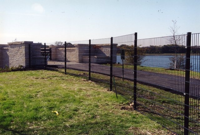 black metal fence with vertical rod near pnd side